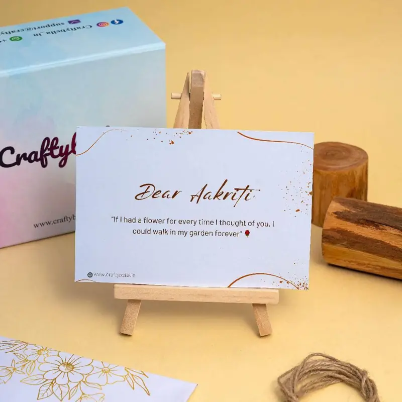 Craftybella personalised gift card on an easel, reading Dear Aditi